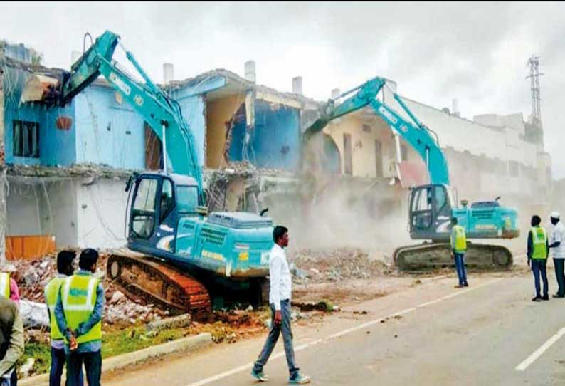 மானாமதுரையில் 4 வழிச்சாலை பணிக்காக கட்டிடங்கள் இடிப்பு; இட உரிமையாளர்கள், அதிகாரிகள் வாக்குவாதம்