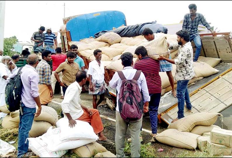 கம்பத்தில், ரே‌‌ஷன் பொருட்கள் ஏற்றி வந்த லாரி குடிநீர் கேட்வால்வு தொட்டியில் சிக்கியது - சாலையில் தண்ணீர் வீணாக பெருக்கெடுத்து ஓடியதால் பரபரப்பு