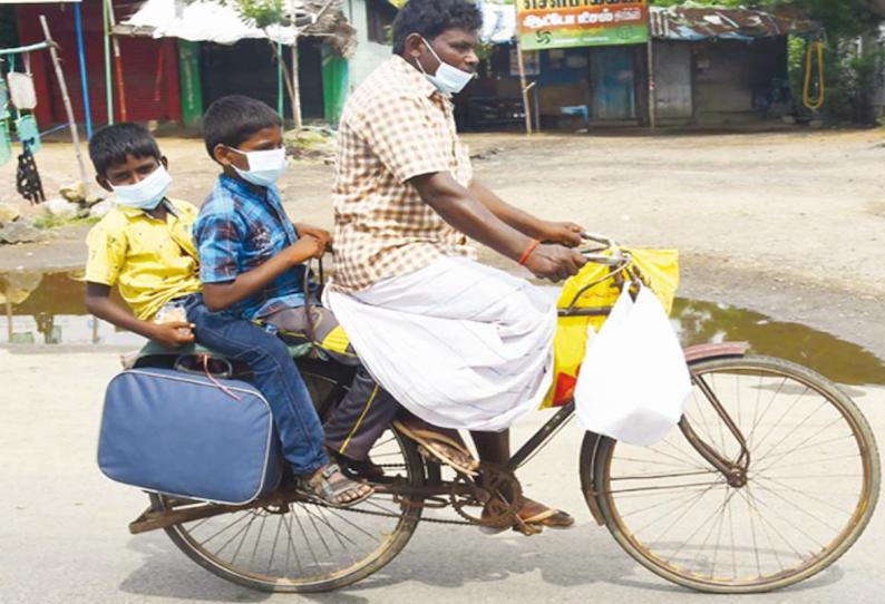 திருக்காட்டுப்பள்ளியில் இருந்து 2 மகன்களை சொந்த ஊருக்கு சைக்கிளில் அழைத்து சென்ற தொழிலாளி