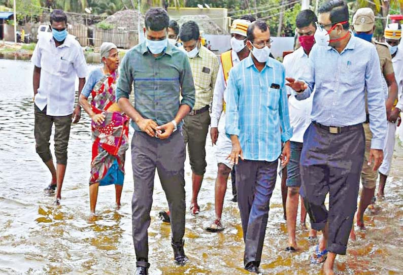 ராமேசுவரம் நடராஜபுரம் பகுதியில் தேங்கி நிற்கும் மழை நீரை நேற்று மாவட்ட கலெக்டர் தினேஷ் பொன்ராஜ் ஆலிவர் ஆய்வு