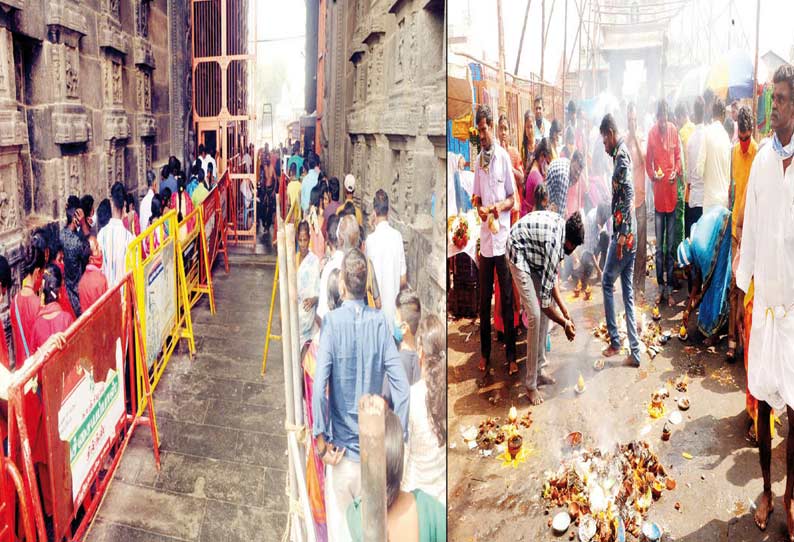 அருணாசலேஸ்வரர் கோவில் ராஜகோபுரம் முன்பு பக்தர்கள் விளக்கு ஏற்றி வழிபடுவதை படத்தில் காணலாம்.