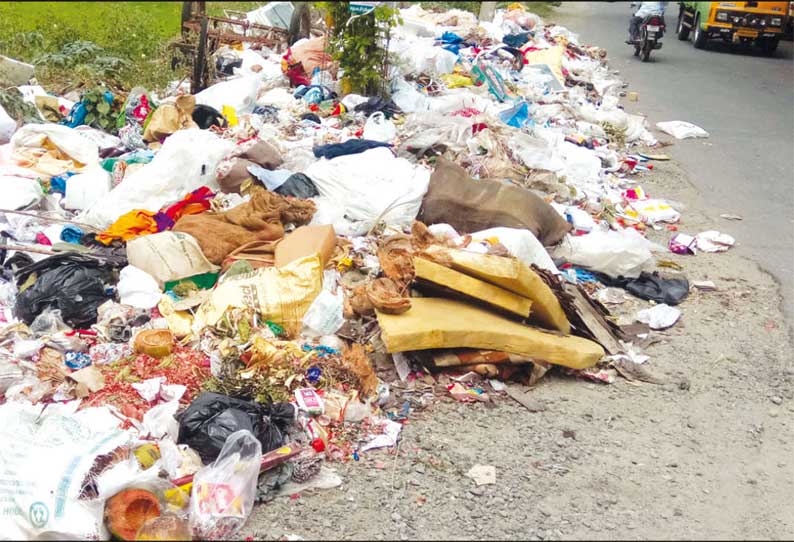 கரூர் எம்.ஜி.ரோட்டில் குவிந்து கிடக்கும் குப்பைகள் நடவடிக்கை எடுக்க பொதுமக்கள் கோரிக்கை