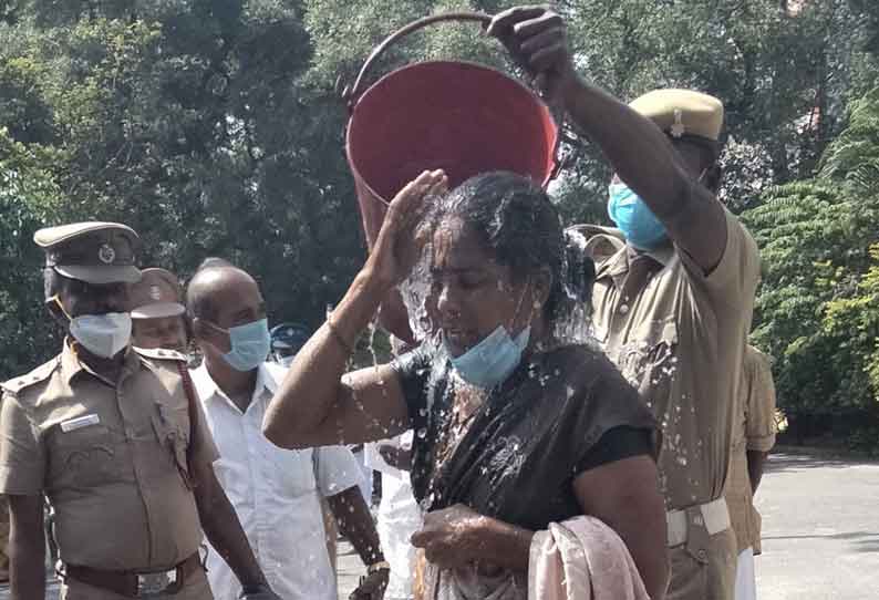 தர்மபுரி கலெக்டர் அலுவலகத்தில் ஆசிரியர் மனைவி தீக்குளிக்க முயன்றதால் பரபரப்பு