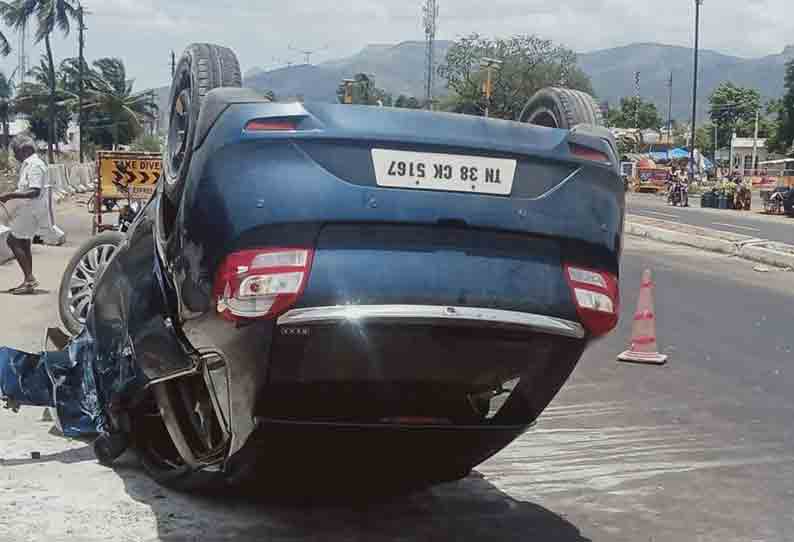 சாலையில் தலைக்குப்புற கவிழ்ந்த கார்