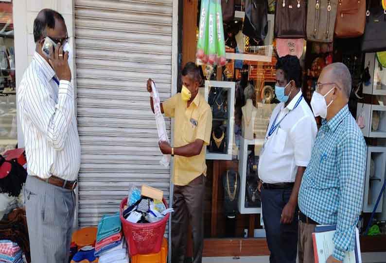 கூடலூரில் விதிகளை மீறி திறந்திருந்த துணிக்கடைகளுக்கு ரூ.10 ஆயிரம் அபராதம்