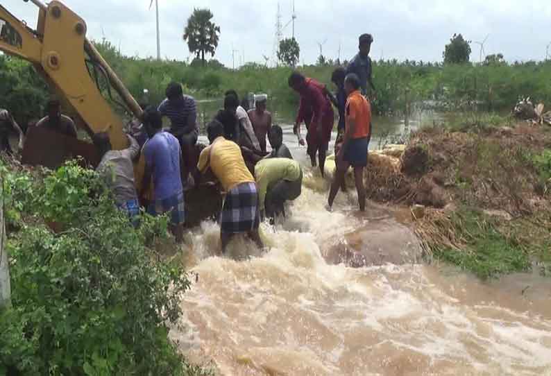 கால்வாயில் ஏற்பட்ட உடைப்பை சீரமைத்த கிராம மக்கள்