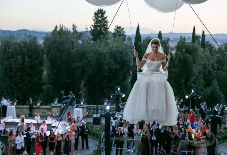Bride enters the wedding venue floating in 250 helium balloons. Don't miss viral video The
