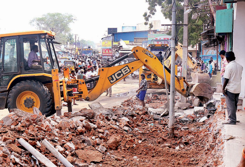 காந்திமார்க்கெட் அருகே 2–வது நாளாக ஆக்கிரமிப்புகள் அகற்றம் அதிகாரிகளுடன் வியாபாரிகள் வாக்குவாதம்